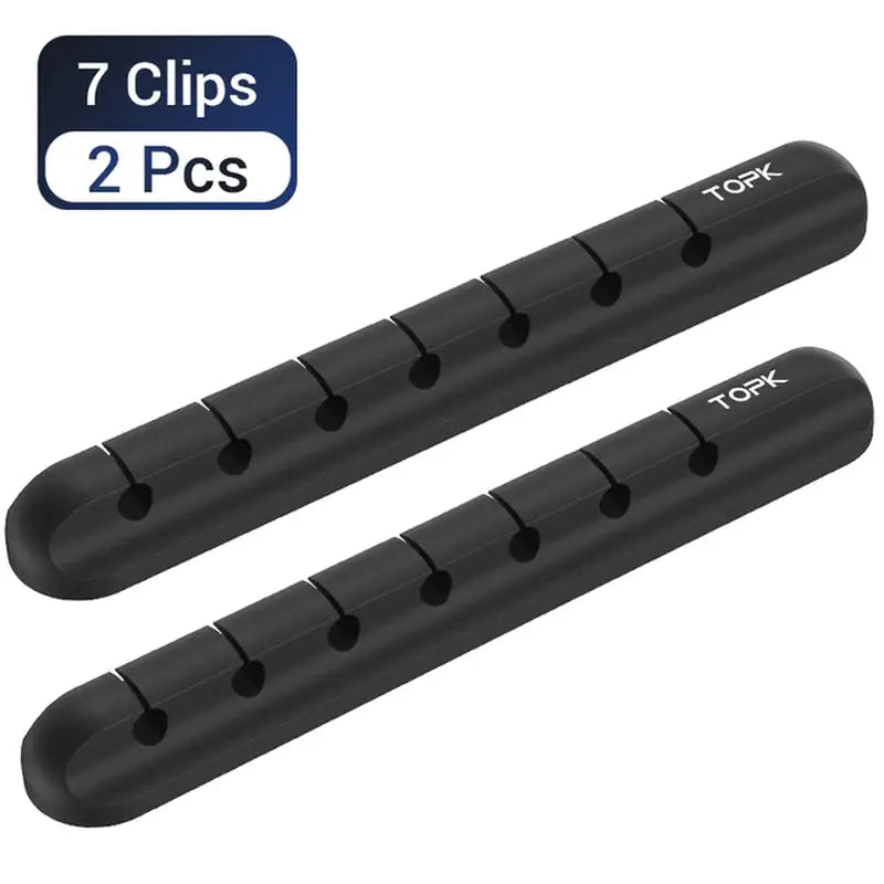 pair of black plastic pegs for the tk