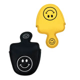 a pair of smiley face shaped key chains