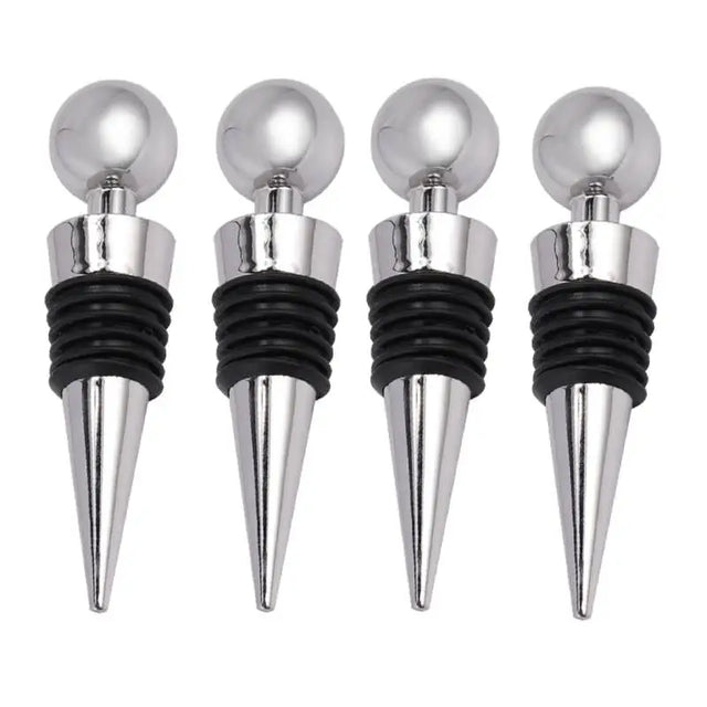 three silver wine stoppers with black tops and silver balls