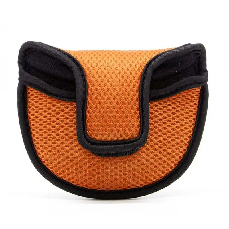 a small orange and black dog carrier
