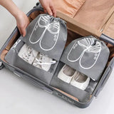 a woman packing her luggage with a suitcase