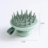 a green ceramic brush with spikes on it