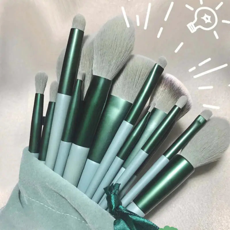 a bunch of makeup brushes in a bag
