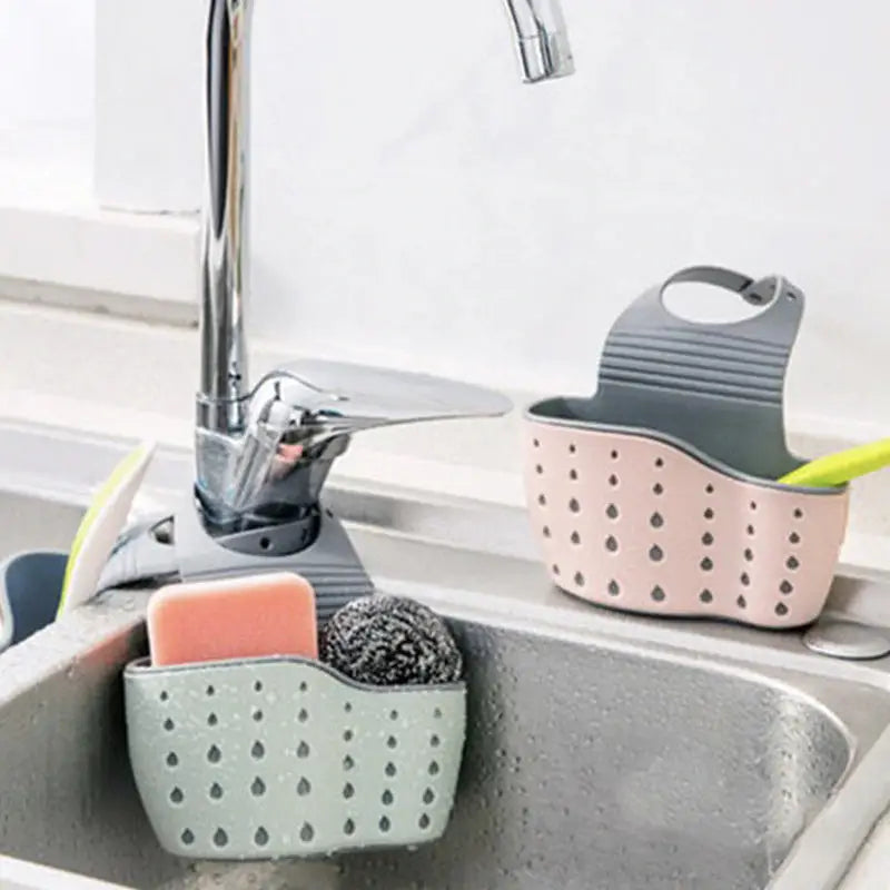 a sink with soap and sponges in it