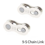 pair of silver plated metal clasps with a white background