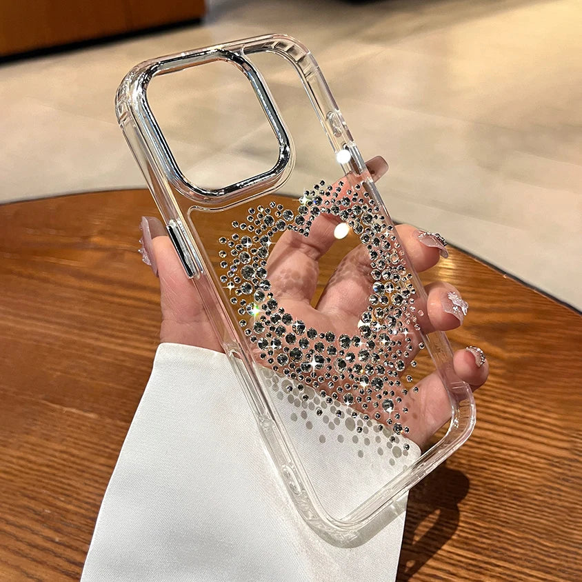 Clear phone case with rhinestone heart.