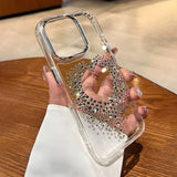 Clear phone case with rhinestone heart.