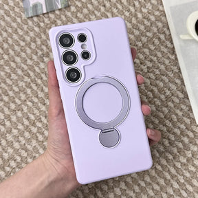 A lavender phone case with a silver ring holder.