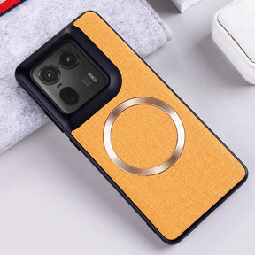 Yellow fabric-textured phone case with a black camera module cutout and a gold magnetic ring.