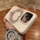 Rhinestone-studded phone case.