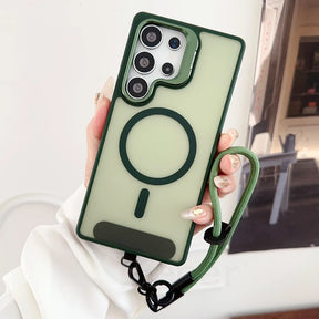 A green-edged, translucent phone case with a built-in magnetic ring and an attached wrist strap.