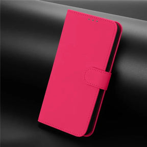 Hot pink faux leather wallet phone case with a magnetic clasp.