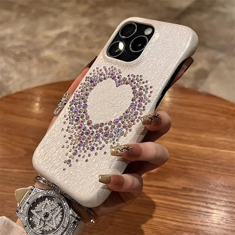 White phone case with rhinestone heart.