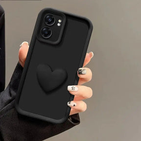 Black phone case with a 3D heart design and camera protection.