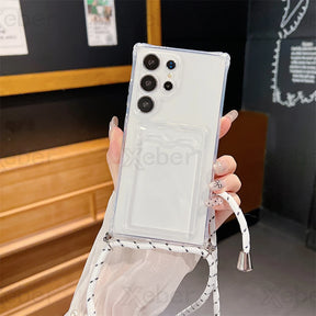 Clear smartphone case with a card slot and an attached black and white lanyard.