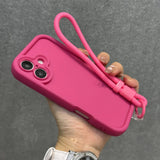 Hot pink silicone phone case with a matching wrist strap.