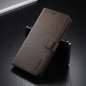 Brown leather wallet phone case with a magnetic clasp.