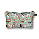 a cosmetic bag with a pattern of cats and flowers