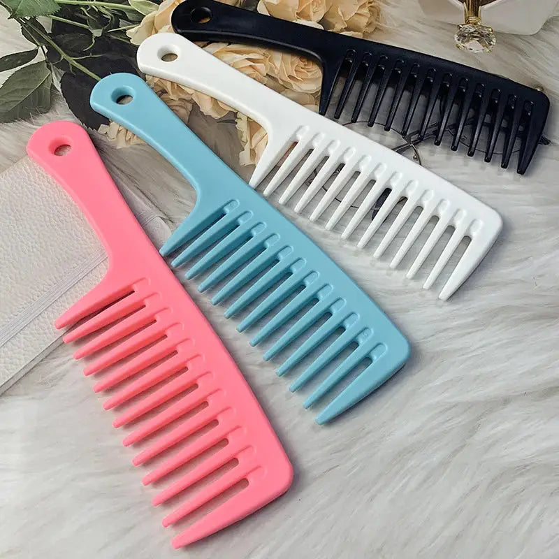a set of hair combs with a pink and blue comb