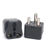 a black adapt plug with two plugs