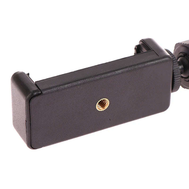 Adjustable smartphone holder or mount with a gold-colored screw.