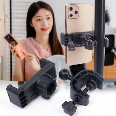 Adjustable smartphone mount or clamp for attaching phones to tripods or other surfaces.