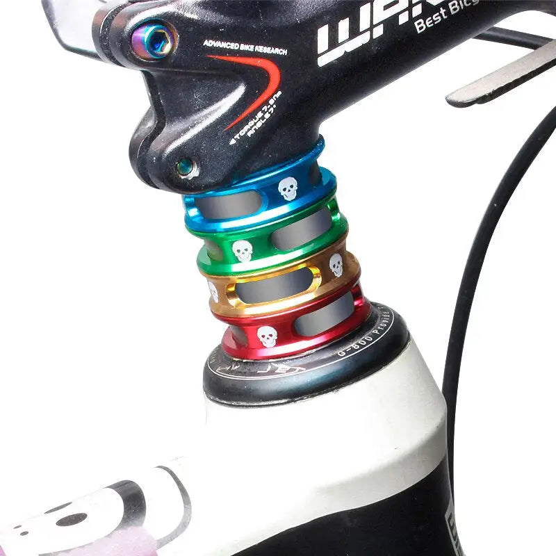 the front end of a bike with a colorful handle
