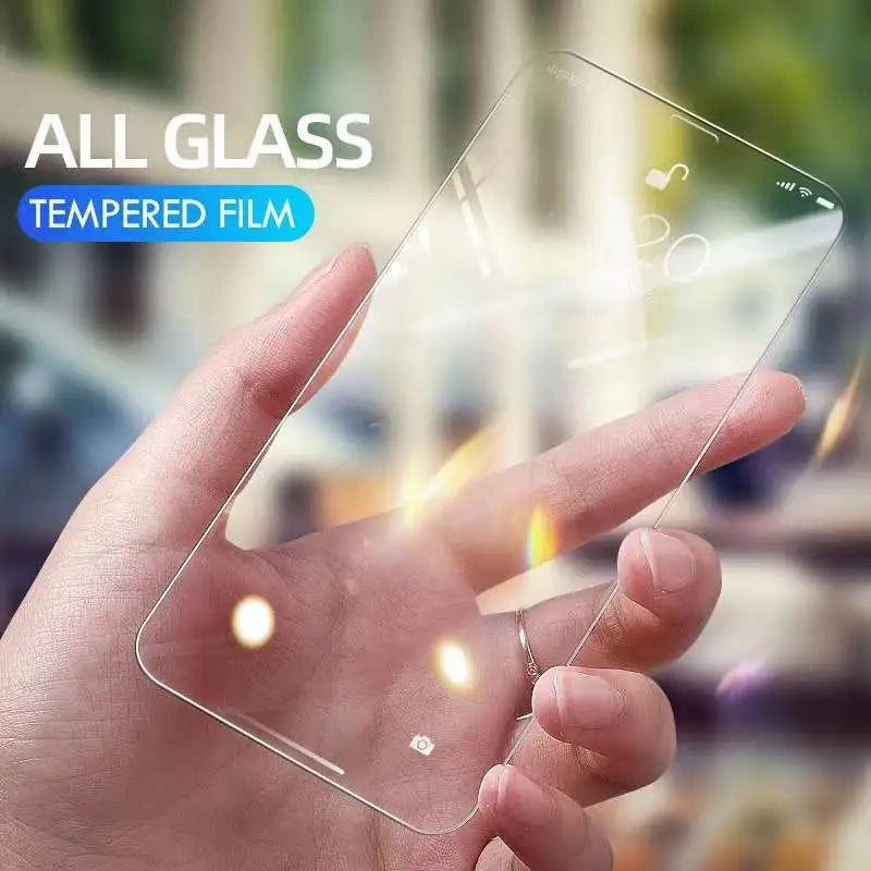 a hand holding a glass screen protector