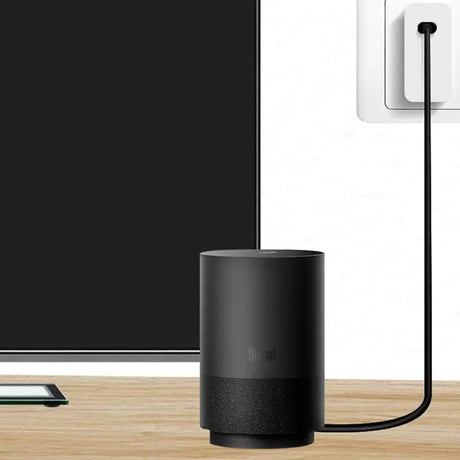 an amazon echo device next to a smart tv