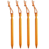 three orange plastic darts with a white background