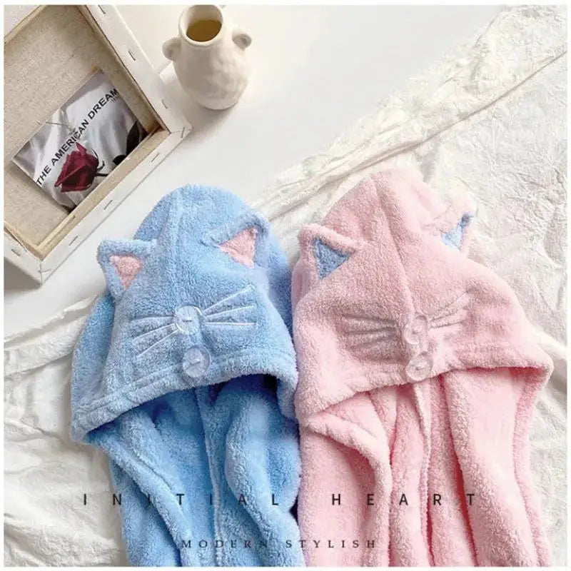 a pair of bath robes with a cat ears on the front