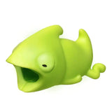 a green toy fish with its mouth open