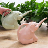 a person is putting a pot with a small elephant