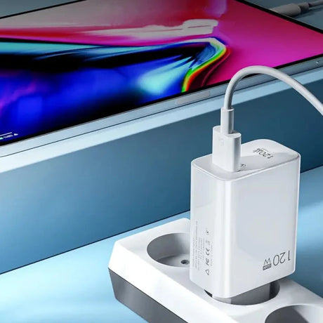 an iphone charging station with a charging cable attached to it