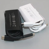 a white and black charger with a black cable