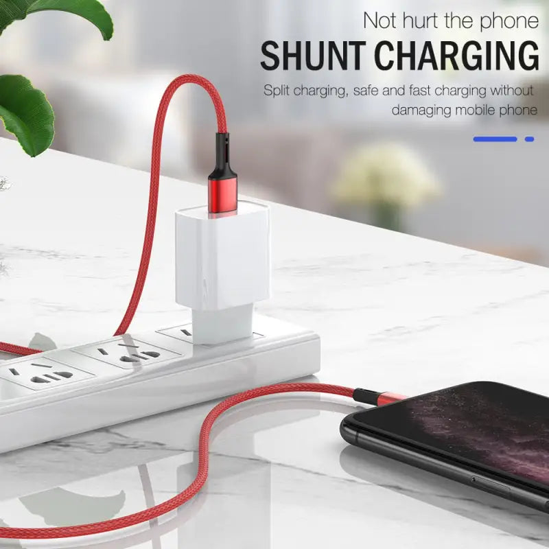 a white phone charging station with a red cable