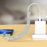 a white charging device on a table