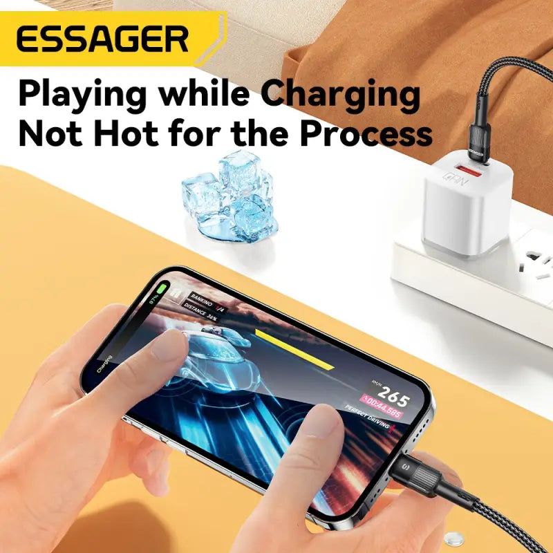 a person holding a phone with a charging cable