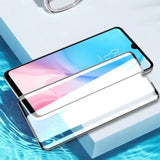 a smartphone with a glass screen on top of it