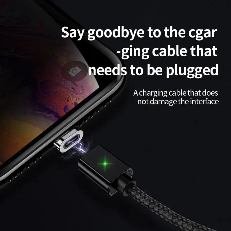 a close up of a cell phone with a charging cable attached