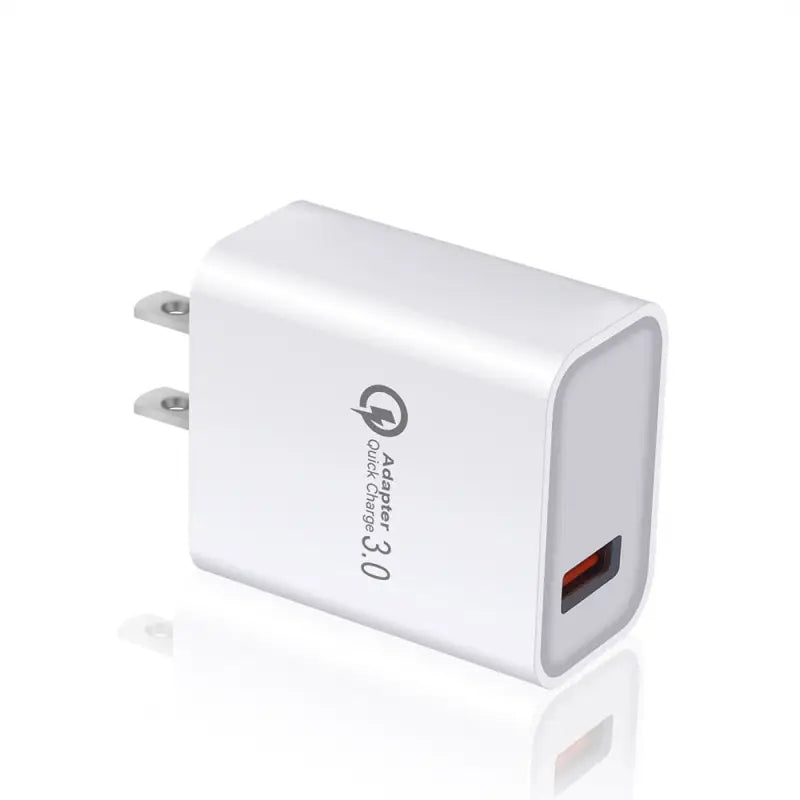 a white usb charger with a usb port attached to it