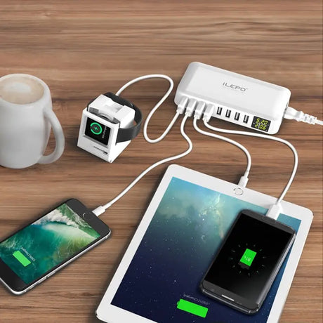 an image of a charging station with a cup and a phone