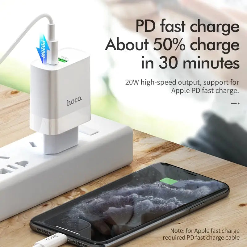 an iphone charging station with a phone and a charger