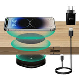 anker wireless charging station with a phone and a charger