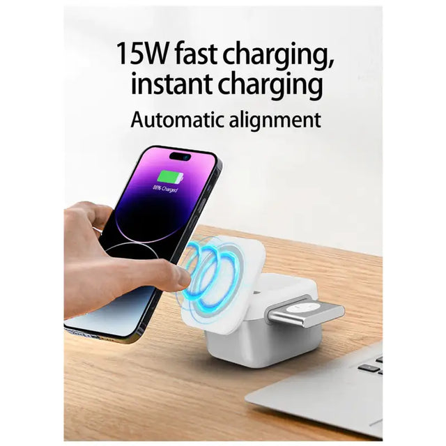 anker wireless charging station with a phone and a laptop