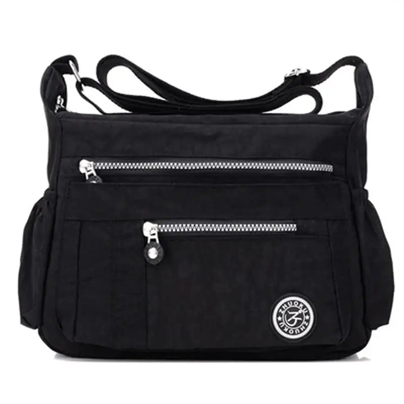 the black nylon bag with zippers and zipper closure