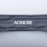 a grey headband with the word aoie on it