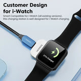 an apple watch with a charging cable attached to it