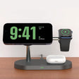 An apple watch and an apple watch stand on a table