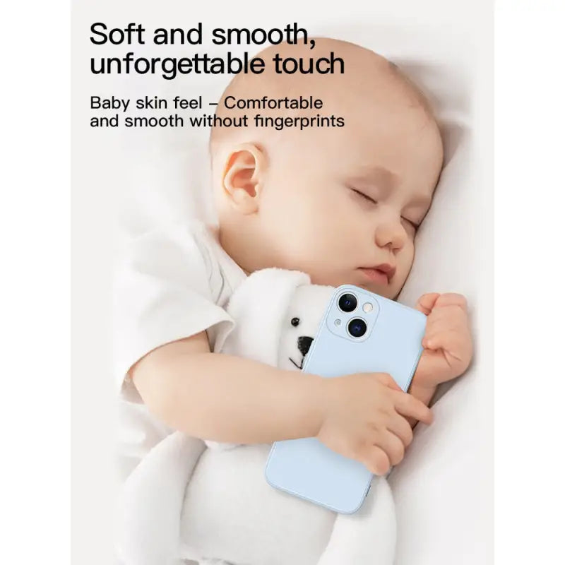 a baby sleeping with a stuffed bear toy